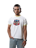 A man wearing a white ringer t-shirt with a retro cassette graphic that reads 'GENX APPROPRIATE' in red, blue, and yellow, paired with light blue jeans, standing against a solid gray studio background.