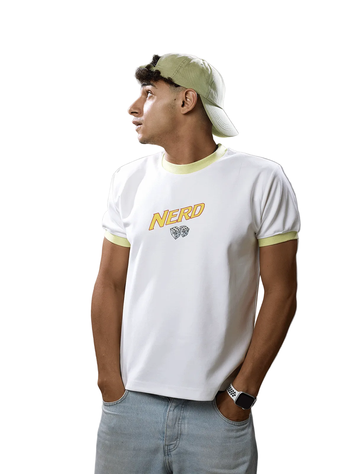 A man wearing a white ringer t-shirt with yellow-green trim and a yellow 'NERO' graphic on the chest, paired with a light green cap and light blue jeans, standing against a solid gray studio background.